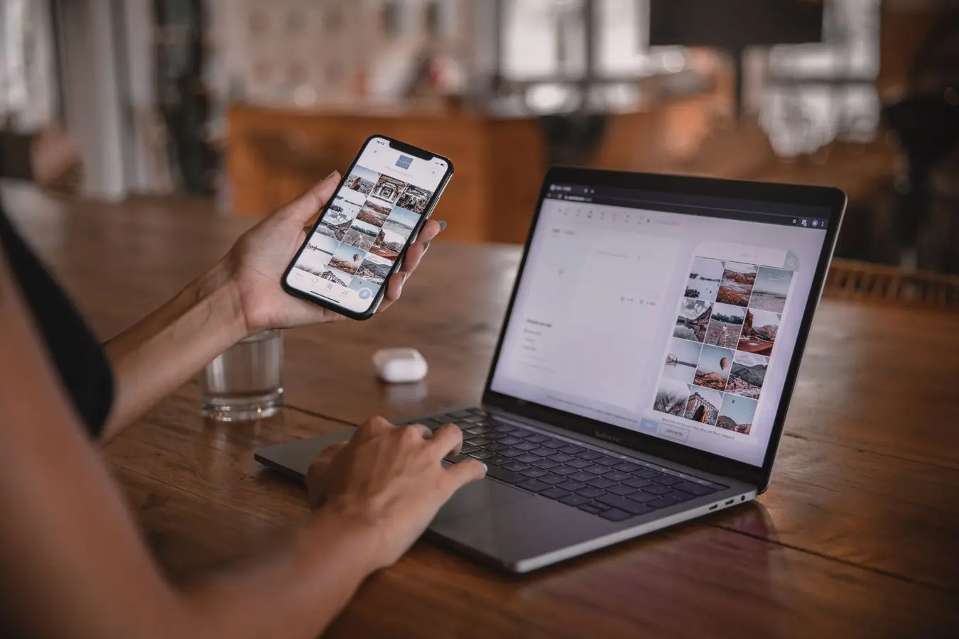 A content professional working across a phone and laptop