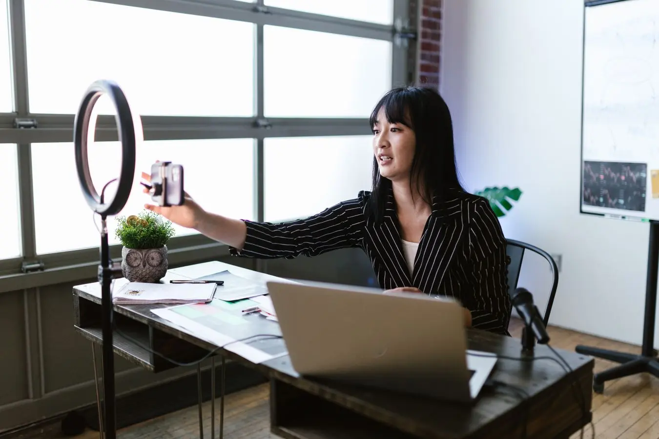 A content specialist recording and planning social media content